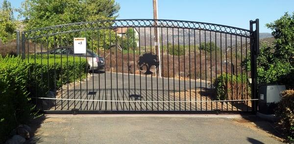 Custom iron gate with Oak tree cut out. Rings on top are 4"