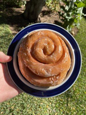 Cinnamon Roll!!!! Very light. Not too sweet. Buy an extra one. It will make your friend/parent/kid's day!