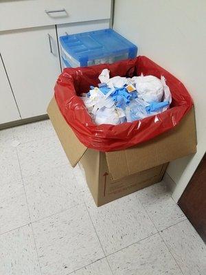 This is what I found at Dr Leschek exam room.This waste should be in a special container.Not left in the open like this.Not sanitary at all.