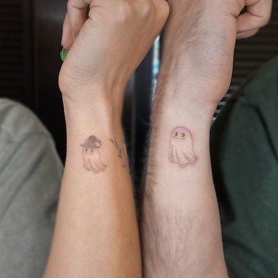 mother and son dot work ghost tattoos