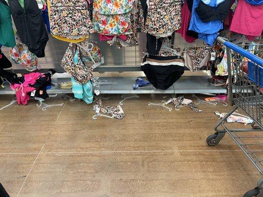 Clothing articles and hangers on the ground.