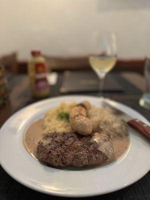 Beef filet tenderloin with German potato salad and sauerkraut plus a side of sausage