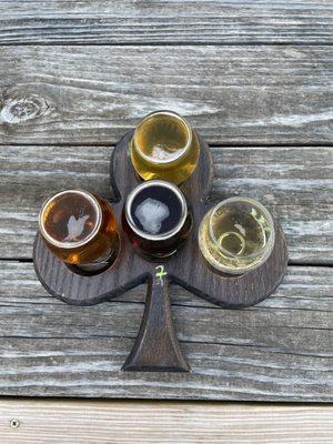 Flight of beer - four 5oz glasses of beers on tap of your choice. Write the number in chalk next to each hole.