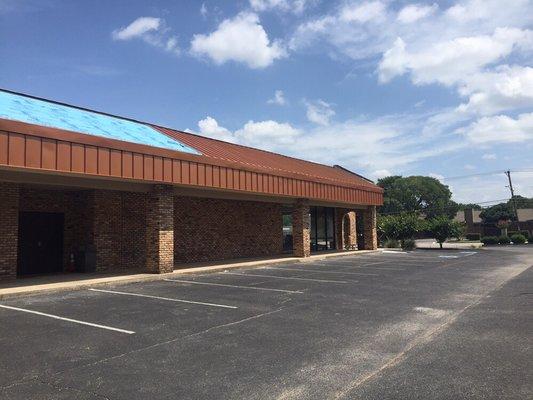 Adding new metal roof and facade to a commercial bldg.