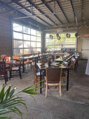 Back patio for private event. Garage doors raise up for fresh air if needed.