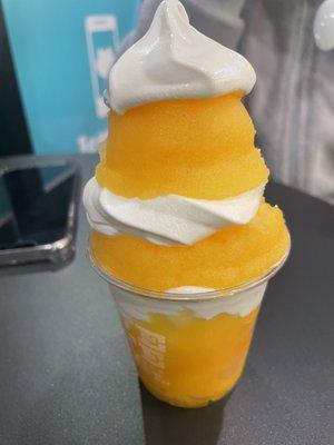 Mango Italian ice and vanilla soft cream layers