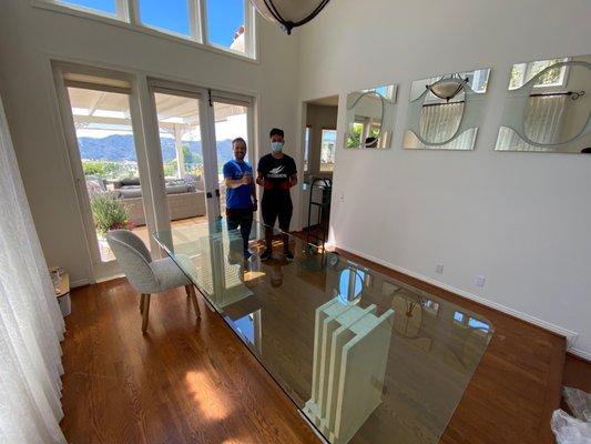 This glass table and marble footer is Heavy! They were extremely careful with the move and installation.