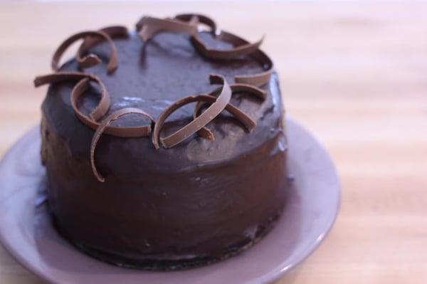 Chocolate Mousse cake - chocolate mousse between two layers of chocolate cake covered in rich chocolate icing