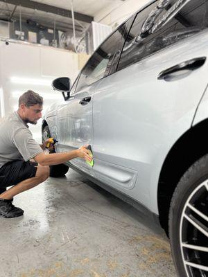 Precision in every detail! Our team ensures your vehicle gets the best care. #AustinFilmSolutions #CarCare