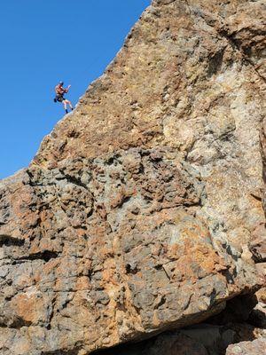 Climber on the top of the rock.