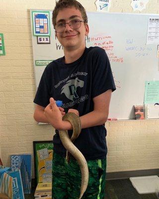 High school holding a snake