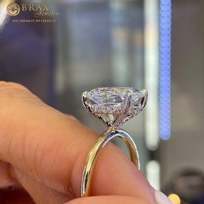 Custom engagement ring featuring a stunning hidden halo and platinum head