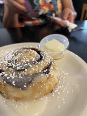 Fresh cinnamon roll, just out of the oven.