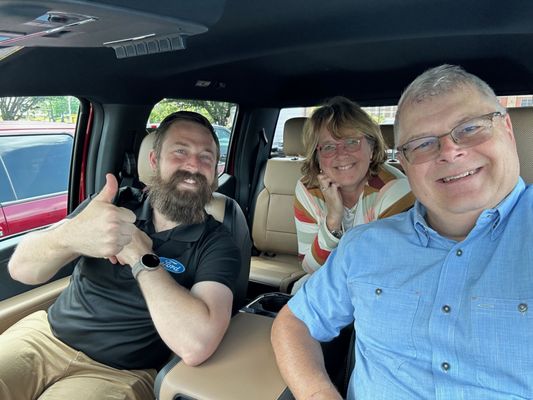 Carl Dassinger with Scott and Frieda Gureck during delivery of their new 2023 F-350 Super Duty.