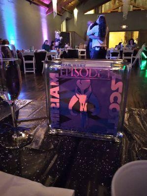 Glass sand block used instead of a unity candle. On bridal table overlooking the main floor.