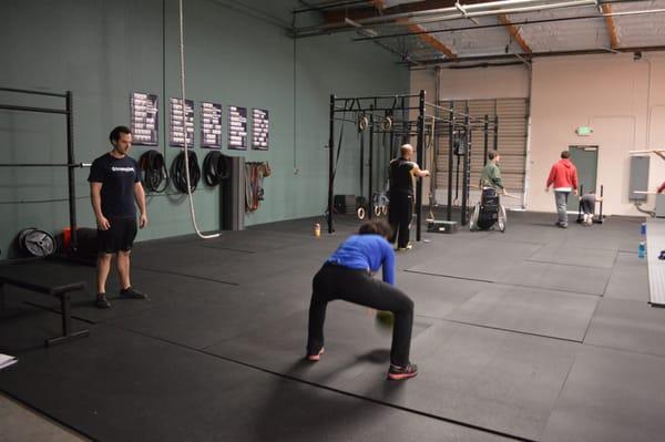 Action shot.. Ball slams, dips, mobility with a dowel rod and sled pushes