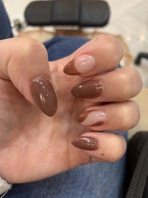 Almond shape with dip powder and gel design.