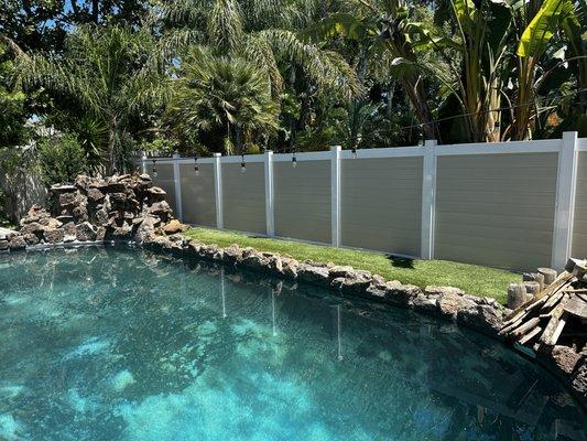 Wood-Grain Vinyl Fence with White Vinyl Accents. A perfect beachy vibe to keep summer rolling all year round.