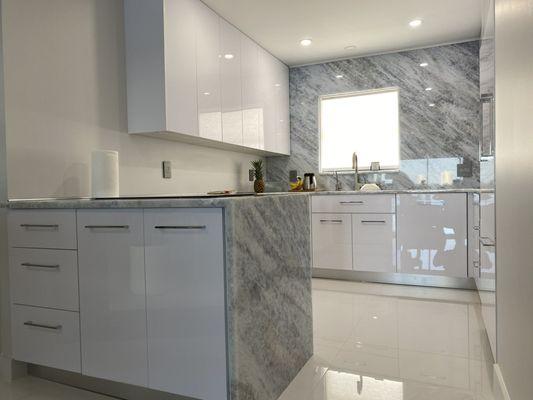 Beautiful custom kitchen with waterfall countertop.