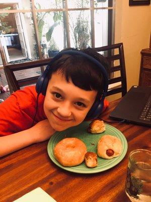 My son enjoying his share of kolaches and a perfectly glazed donut! We love this place!