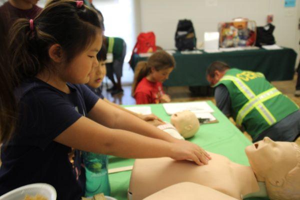 Kids learned about CPR at the CERT Emergency Preparedness Fair inside the Nisei Veterans Memorial Hall.