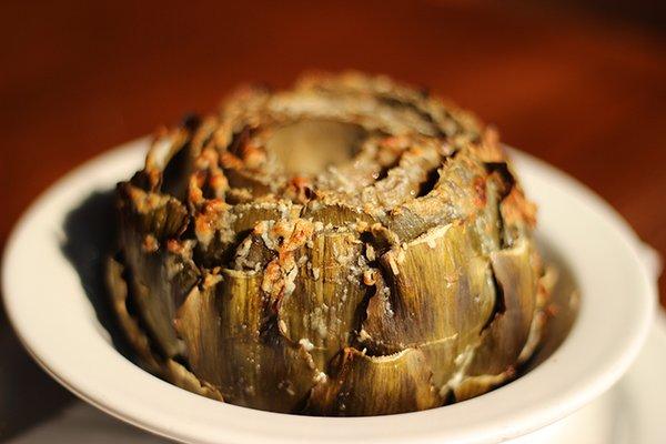 Baked Artichoke with lemony Caesar sauce and parmesan cheese!