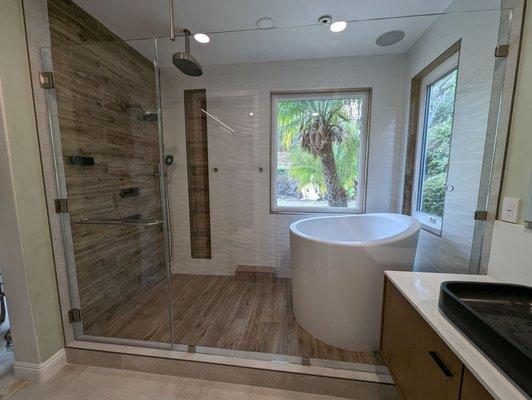 Full bathroom with glass wall