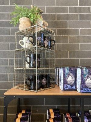 Mugs and coffee beans for sale. Nice decor.