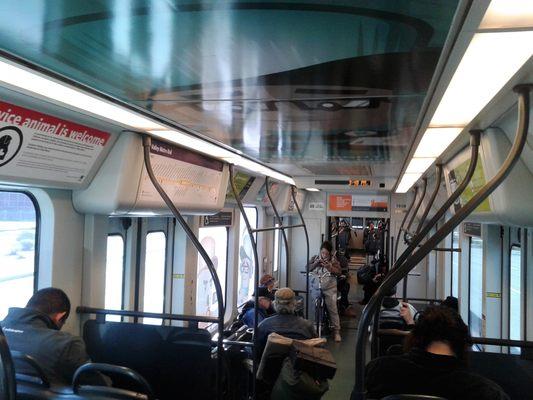 This is a somewhat crowded light rail train mid-day.