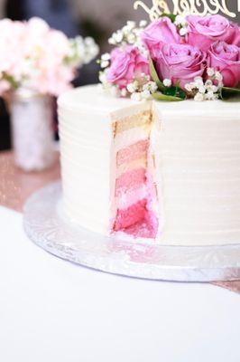 Almond Falvored Cake with whipped cream filling and vanilla buttercream frosting