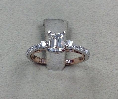 Engagement Ring, with a emerald cut 1 carat diamond, and a hint of rose gold.