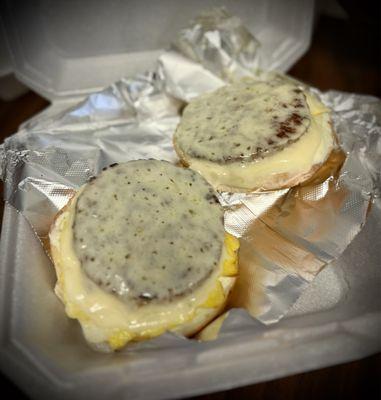 Sausage, egg, and cheese melt on a plain bagel