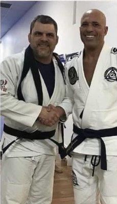 Being promoted to Black Belt Professor by Master Royce Gracie