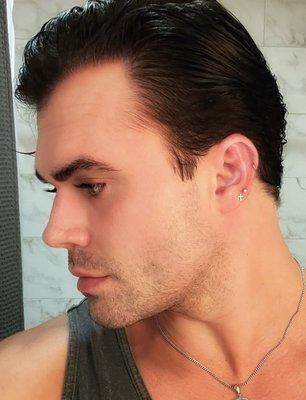 Left ear with 3 piercings