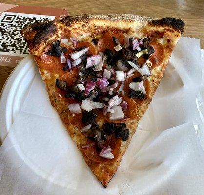 Single slice with pepperoni, red onions, and Portabella mushroom