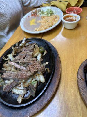 Lunch portion of beef fajitas with sides