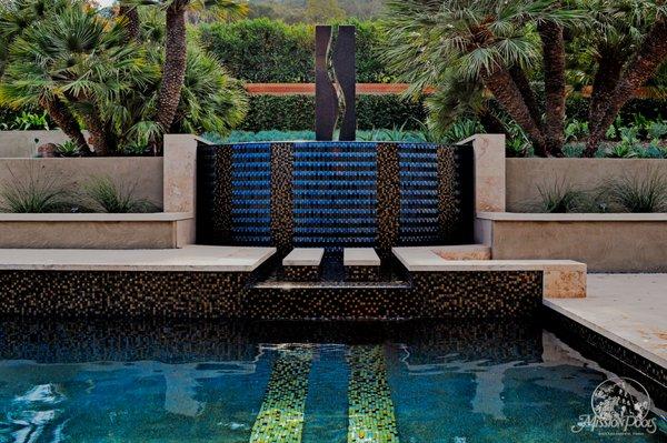 Geometric Pool with floating steps and an overflow wall