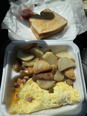 Western omelette plate (ham, cheese, tomatoes, onions and bell pepper), with home fries and toast. Everything was great.