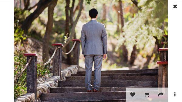 Horrible puckering in the upper back, ridiculous cinching in waist, and messy/uneven tailoring of his pants.