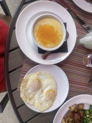 Grits with cheese and two over easy eggs