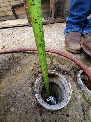 Dropping a camera snake down a pipe to inspect where the leak is at.