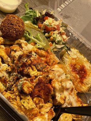 Halal Chicken Shawarma Plate with falafel on the side .