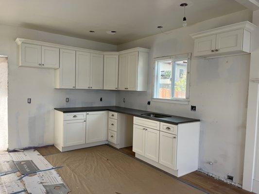 Hollis White cabinets with "Grey Pearl" quartz