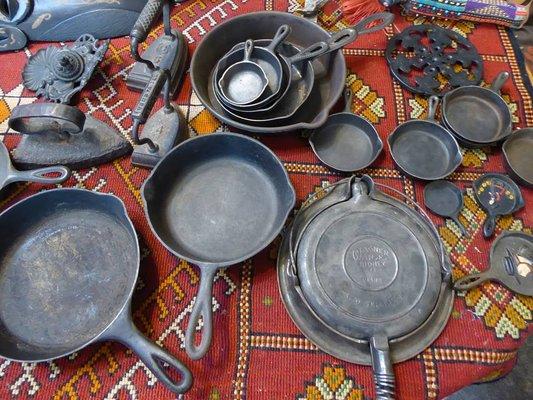 Antique cast iron skillets and irons.