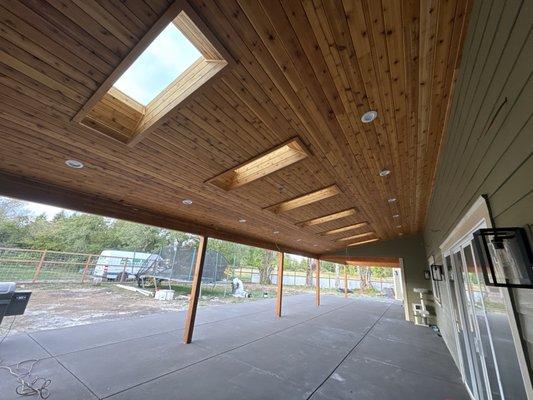 Cover porch with 7 skylights  Knotted cedar