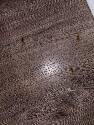 Burnt cig markings on the Formica floors.