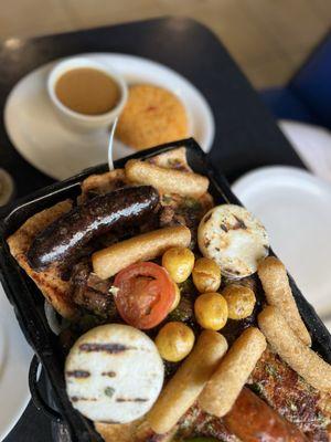 Meat sampler, with yellow rice beans as sides