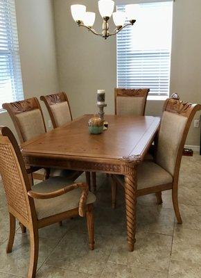 part of a dining table, 8 chairs, additional leaf, and sofa table