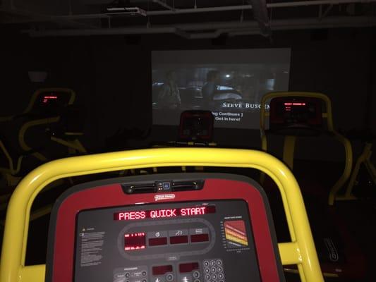 A theater setup with various cardio equipment. Perfect for passing the time as you exercise.