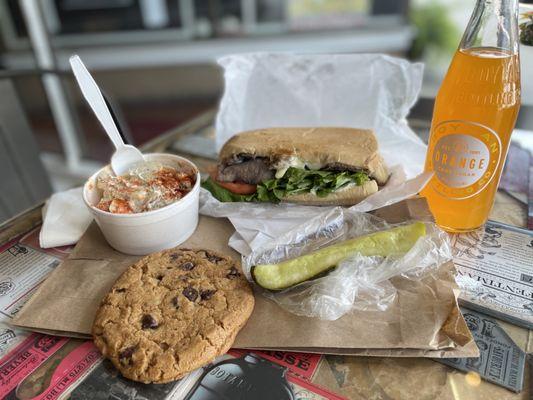 Potato salad, chocolate chip cookie, pickle spear, orange cane sugar soda, steak and cheese roast beef 6"